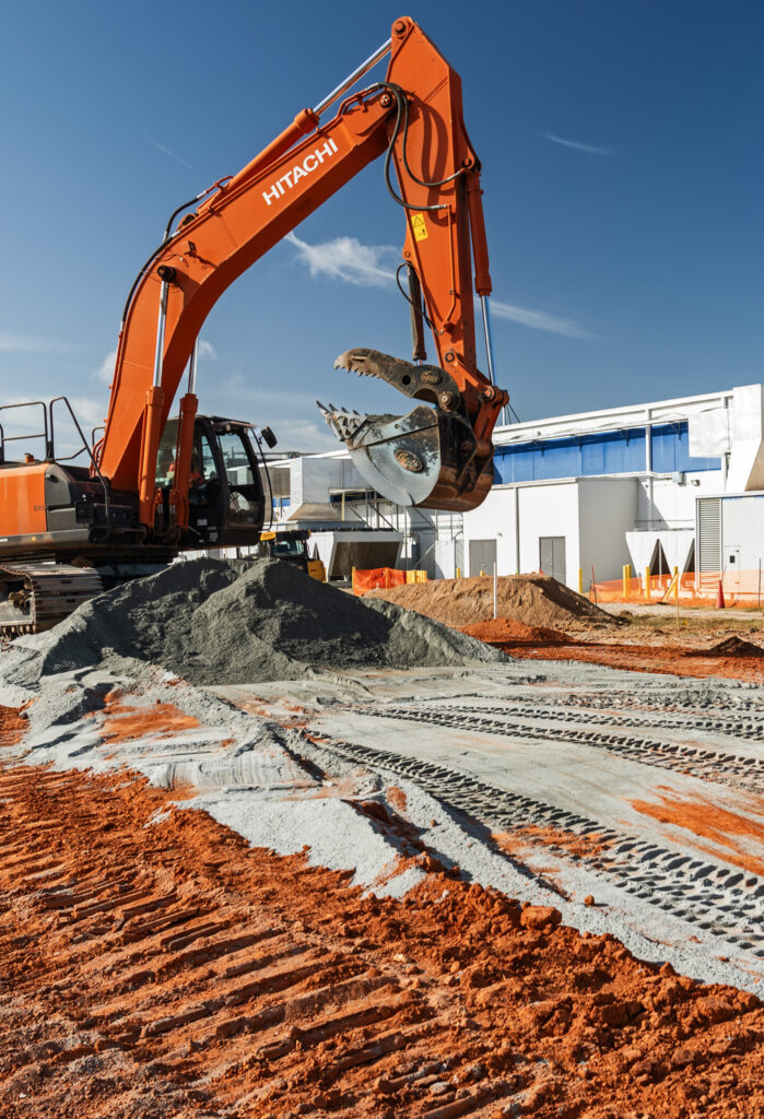 Industrial Construction crew grading at manufacturing plant