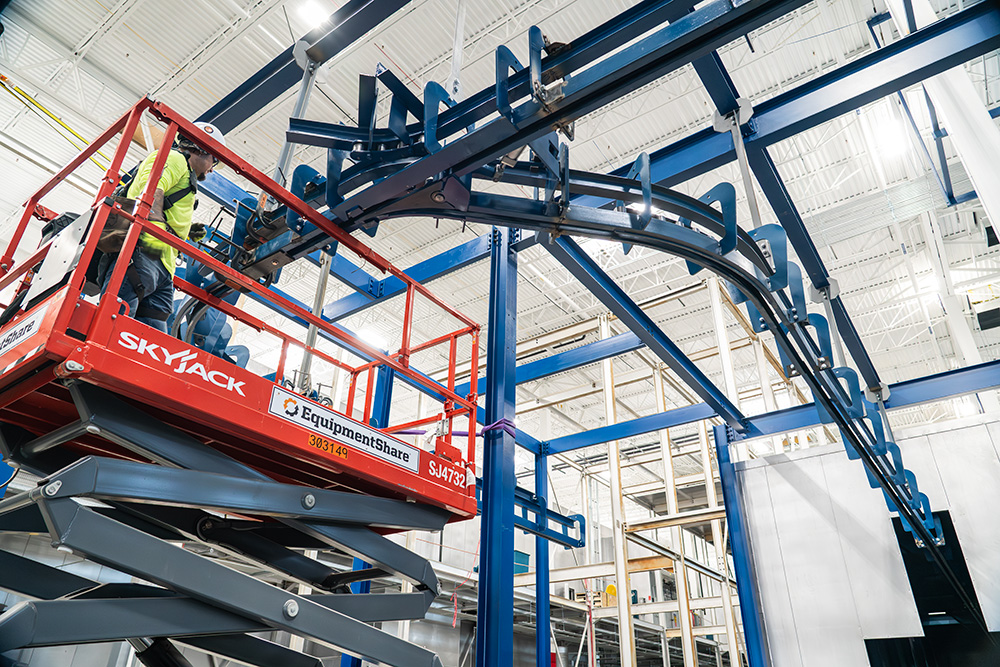 Overhead Conveyor install by millwright crew member