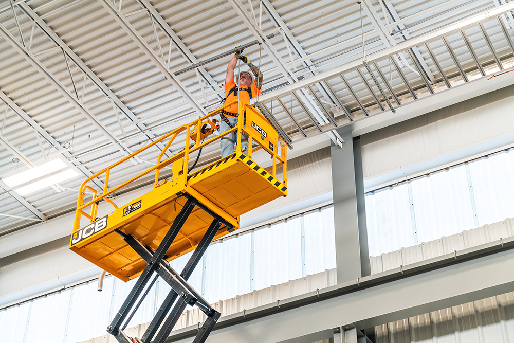 Industrial Electrician installing cable tray