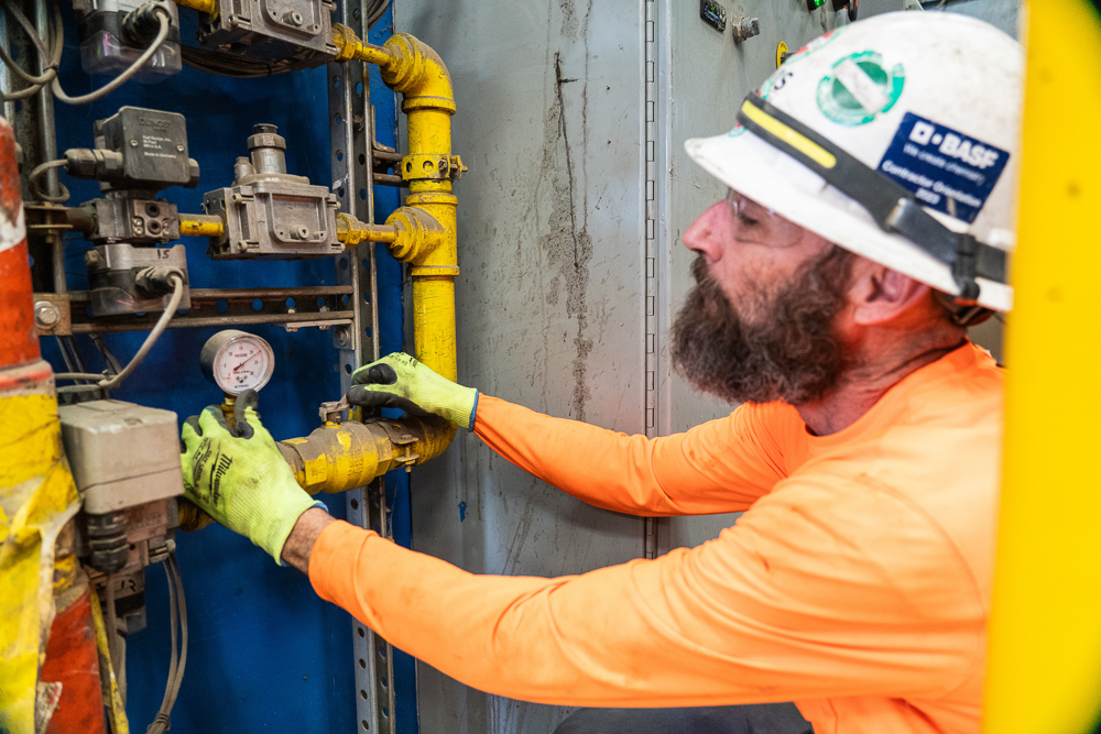industrial contractor checking on maintenance items