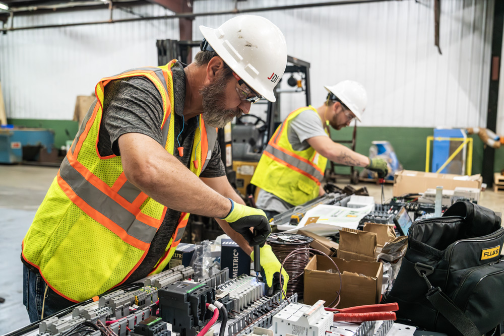 Mark and Wyatt putting subdeck motor control panels together