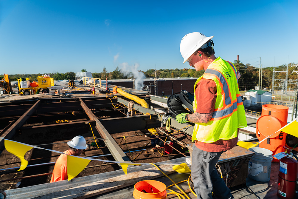Lights being placed through roof for facility lighting upgrade